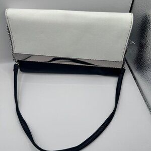 No Boundaries Faux Leather Black & White “Bar Clutch” with shoulder chain.